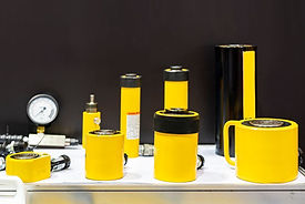Various size and type hydraulic cylinder jack and accessories for lifting heavy item or object in industrial